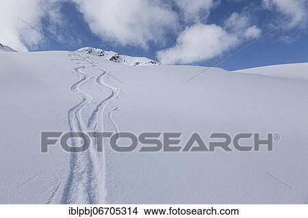 Two lonely ski tracks in front of a blue sky, Kühtai, Tyrol, Austria, Europe View Large Photo Image Picture - Two lonely ski tracks in front of a blue sky, Kühtai, Tyrol, Austria, Europe. Fotosearch