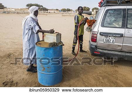 Unconventional way of fueling gass, Sahel, Chad, Africa View Large Photo Image Stock Photo - Unconventional way of fueling gass, Sahel, Chad, Africa. Fotosearch