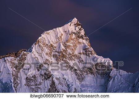 Stock Photo - View from Kala Patthar in the evening light on Nuptse west flank, 7861 m, Sagarmatha National Park, Khumbu Himal, Himalaya, Nepal, Asia. Fotosearch