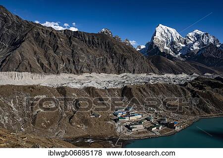 Stock Photo - View from Renjo La Pass 5417 m to the east on Himalaya with Gokyo Lake and Gokyo, Ngozumba Glacier, longest glacier in the Himalaya and Cholatse 6440 m, Khumbu Himal, Himalaya, Nepal, Asia. Fotosearch