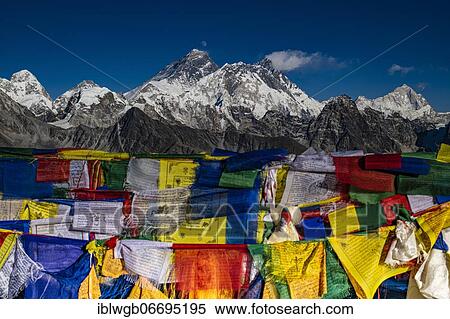 Stock Photography - View from Renjo La Pass 5417 m with Buddhist prayer flags to the east on Himalaya with Mount Everest, 8848 m, Nuptse, 7879 mn Lhotse, 8516 m and Makalu, 8485 m, Khumbu Himal, Himalaya, Nepal, Asia. Fotosearch