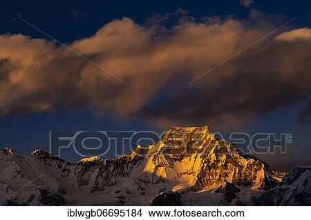 Picture - View in the evening light from Renjo La Pass 5417 m to the east on Himalaya with Gyachung Kang, 7952 m, Khumbu Himal, Himalaya, Nepal, Asia. Fotosearch