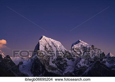 Picture - View in the evening light from Renjo La Pass 5417 m to the east to Cholatse, 6440 m, and Taboche, 6501 m, Khumbu Himal, Himalaya, Nepal, Asia. Fotosearch