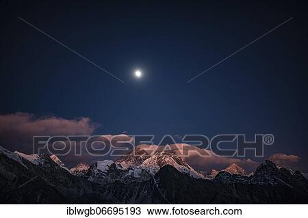 Stock Image - View in the moonlight from Renjo La Pass 5417 m to the east on Himalaya with Mount Everest, 8848 m, Nuptse, 7879 m, Lhotse, 8516 m and Makalu, 8485 m, Khumbu Himal, Himalaya, Nepal, Asia. Fotosearch
