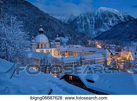 Stock Photo - View of the village with the monastery at dusk, Ettal, Ettaler Sattel, Ammergau Alps nature park Park, Upper Bavaria, Bavaria, Germany, Europe. Fotosearch