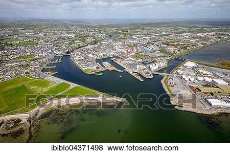View of town and harbour, docks and Business Enterprise Park, Galway, County Clare, Ireland, Europe View Large Photo Image Stock Photo - View of town and harbour, docks and Business Enterprise Park, Galway, County Clare, Ireland, Europe. Fotosearch