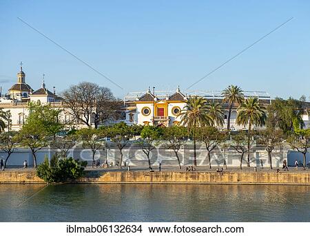 View over the river Rio Guadalquivir to the bullring Plaza de toros de la Real Maestranza de Caballería de Sevilla, Sevilla, Andalusia, Spain, Europe View Large Photo Image Picture - View over the river Rio Guadalquivir to the bullring Plaza de toros de la Real Maestranza de Caballería de Sevilla, Sevilla, Andalusia, Spain, Europe. Fotosearch