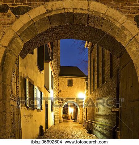 View through the Rhine Gate in the evening, Zons, Dormagen, Lower Rhine, North Rhine-Westphalia, Germany, Europe View Large Photo Image Picture - View through the Rhine Gate in the evening, Zons, Dormagen, Lower Rhine, North Rhine-Westphalia, Germany, Europe. Fotosearch