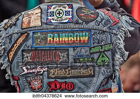 Visitor with patches on jacket, rear view, Monsters of Rock, hard rock festival, Sankt Goarshausen, Rhineland-Palatinate, Germany, Europe View Large Photo Image Picture - Visitor with patches on jacket, rear view, Monsters of Rock, hard rock festival, Sankt Goarshausen, Rhineland-Palatinate, Germany, Europe. Fotosearch
