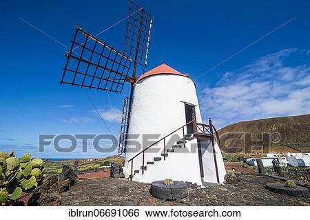 Windmill in the Jardín de Cactus, cactus garden Cesar Manrique, Lanzarote, Canary islands View Large Photo Image Stock Photograph - Windmill in the Jardín de Cactus, cactus garden Cesar Manrique, Lanzarote, Canary islands. Fotosearch