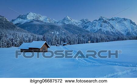 Winterly hummock meadows with hay barn and Karwendel mountains at dusk, Krün, Werdenfelser Land, Upper Bavaria, Bavaria, Germany, Europe View Large Photo Image Stock Image - Winterly hummock meadows with hay barn and Karwendel mountains at dusk, Krün, Werdenfelser Land, Upper Bavaria, Bavaria, Germany, Europe. Fotosearch