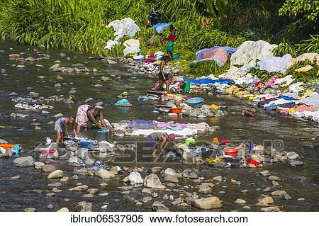 Women washing their clothes in a river at the east coast of Sao Tome, Sao Tome and Principe, Atlantic Ocean, Africa View Large Photo Image Stock Photography - Women washing their clothes in a river at the east coast of Sao Tome, Sao Tome and Principe, Atlantic Ocean, Africa. Fotosearch