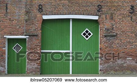 Stock Photo - Yard door, barn door, Ramsloh, Saterland, Oldenburger Münsterland, Lower Saxony, Germany, Europe. Fotosearch