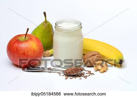 Stock Photograph - Yoghurt in glass with fruits and linseed. Fotosearch