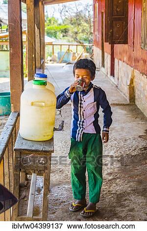 Young boy drinking water, pupil at school, Shan State, Myanmar, Asia View Large Photo Image Stock Photo - Young boy drinking water, pupil at school, Shan State, Myanmar, Asia. Fotosearch