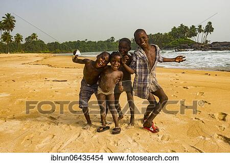 Young boys posing on a beach, Buchanan, Liberia, Africa View Large Photo Image Picture - Young boys posing on a beach, Buchanan, Liberia, Africa. Fotosearch
