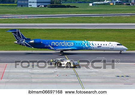 A Bombardier CRJ-900 aircraft of Nordica with registration number ES-ACB at Warsaw Airport (WAW), Warsaw, Poland, Europe View Large Photo Image Stock Photo - A Bombardier CRJ-900 aircraft of Nordica with registration number ES-ACB at Warsaw Airport (WAW), Warsaw, Poland, Europe. Fotosearch