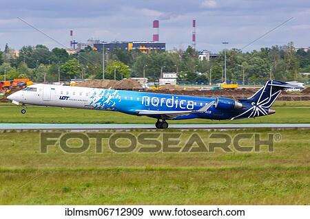 Stock Photo - A Bombardier CRJ-900 aircraft of Nordica with registration number ES-ACB at Warsaw Airport, Poland, Europe. Fotosearch
