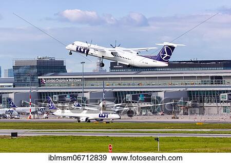 A Bombardier DHC-8-400 of LOT Polskie Linie Lotnicze with the registration SP-EQB takes off from Warsaw Airport, Poland, Europe View Large Photo Image Stock Photo - A Bombardier DHC-8-400 of LOT Polskie Linie Lotnicze with the registration SP-EQB takes off from Warsaw Airport, Poland, Europe. Fotosearch