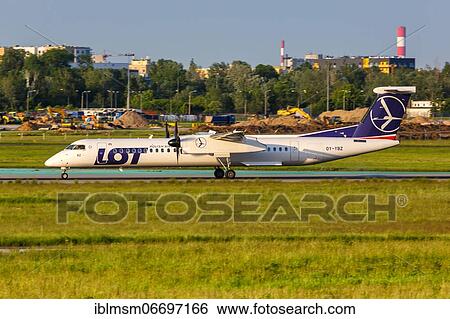A Bombardier DHC-8-400 of LOT Polskie Linie Lotnicze with registration OY-YBZ at Warsaw Airport (WAW), Warsaw, Poland, Europe View Large Photo Image Stock Photograph - A Bombardier DHC-8-400 of LOT Polskie Linie Lotnicze with registration OY-YBZ at Warsaw Airport (WAW), Warsaw, Poland, Europe. Fotosearch