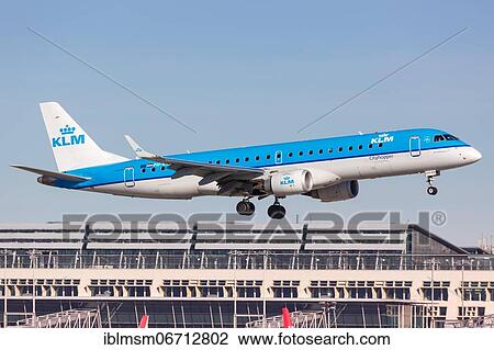 Stock Image - A KLM cityhopper Embraer ERJ190 with registration PH-EXA lands at Stuttgart Airport, Germany, Europe. Fotosearch