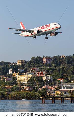Stock Photo - A Lauda Airbus A320 aircraft with registration number OE-LOB at Corfu Airport (CFU), Corfu, Greece, Europe. Fotosearch