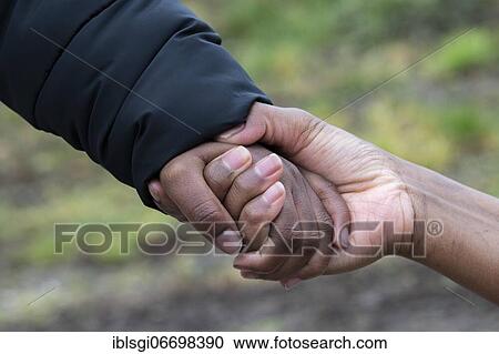A Somali woman who fled to Germany holds the hand of her eight-year-old son, whom she was able to bring back to Germany after months of separation, Erding, Bavaria, Germany, Europe View Large Photo Image Stock Image - A Somali woman who fled to Germany holds the hand of her eight-year-old son, whom she was able to bring back to Germany after months of separation, Erding, Bavaria, Germany, Europe. Fotosearch