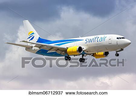 A Swiftair Boeing 737-300SF aircraft with registration number N811TJ lands at Miami Airport, U. S View Large Photo Image Stock Photo - A Swiftair Boeing 737-300SF aircraft with registration number N811TJ lands at Miami Airport, U. S. Fotosearch