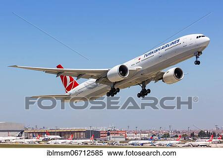 Stock Photography - A Turkish Airlines Boeing 777-300ER with the registration TC-JJM takes off from Istanbul Airport, Turkey, Asia. Fotosearch