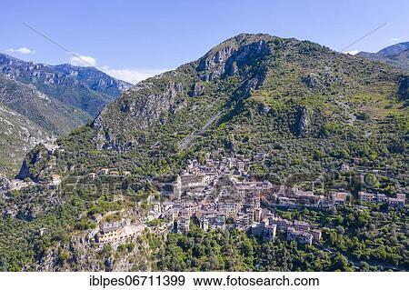 Stock Photo - Aerial view of the mountain village of Saorge above the Roya valley on the road between Ventimiglia on the coast and the Col de Tende pass, Alpes-Maritimes department, Provence-Alpes-Cote d'Azur region, Maritime Alps, France, Europe. Fotosearch