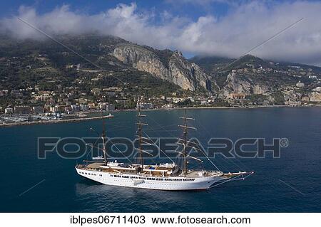 Aerial view of the sailing ship Sea Cloud II, cruise ship of the Hamburg-based Sea Cloud Cruises GmbH at anchor in front of the French coastal town Menton at the border to Italy, Departement Alpes Maritimes, region Provence Alpes Cote d'Azur, France,... View Large Photo Image Stock Image - Aerial view of the sailing ship Sea Cloud II, cruise ship of the Hamburg-based Sea Cloud Cruises GmbH at anchor in front of the French coastal town Menton at the border to Italy, Departement Alpes Maritimes, region Provence Alpes Cote d'Azur, France,.... Fotosearch