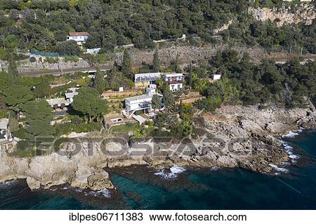 Aerial view rocky coast with the villa E-1027 by Eileen Gray and the Cabanon by Le Corbusier, Roquebrune Cap Martin, Departement Alpes-Maritimes, Region Provence-Alpes-Cote d'Azur, France, Europe View Large Photo Image Stock Image - Aerial view rocky coast with the villa E-1027 by Eileen Gray and the Cabanon by Le Corbusier, Roquebrune Cap Martin, Departement Alpes-Maritimes, Region Provence-Alpes-Cote d'Azur, France, Europe. Fotosearch
