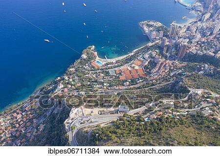 Picture - Aerial view western part of Roquebrune Cap Martin, tennis courts of the Monte-Carlo-Country-Club and the Monte-Carlo Beach Hotel, construction site of the Vista Palace Hotel, in the back Principality of Monaco, Alpes-Maritimes, Provence-Alpes-Cote.... Fotosearch