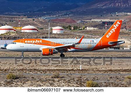 An Airbus A320 aircraft of EasyJet Europe with the registration OE-INQ and the special livery 20 Years at Tenerife South Airport (TFS), Tenerife, Spain, Europe View Large Photo Image Stock Photo - An Airbus A320 aircraft of EasyJet Europe with the registration OE-INQ and the special livery 20 Years at Tenerife South Airport (TFS), Tenerife, Spain, Europe. Fotosearch
