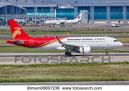An Airbus A320 aircraft of Shenzhen Airlines with registration number B-8077 at Guangzhou Baiyun Airport (CAN), Guangzhou, China, Asia View Large Photo Image Stock Photograph - An Airbus A320 aircraft of Shenzhen Airlines with registration number B-8077 at Guangzhou Baiyun Airport (CAN), Guangzhou, China, Asia. Fotosearch