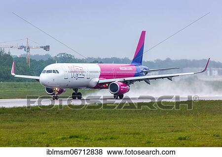 An Airbus A320 aircraft of Wizzair with registration mark HA-LXM takes off from Gdansk Lech Walesa Airport Gdansk, Poland, Europe View Large Photo Image Stock Photo - An Airbus A320 aircraft of Wizzair with registration mark HA-LXM takes off from Gdansk Lech Walesa Airport Gdansk, Poland, Europe. Fotosearch