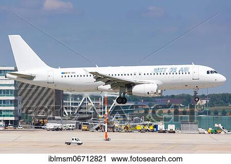 Stock Image - An Airbus A320 of Just Us Air with the registration YR-DSI lands at Stuttgart Airport, Germany, Europe. Fotosearch