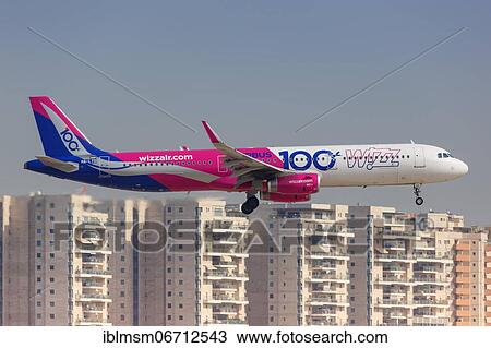 An Airbus A321 aircraft of Wizzair with the registration number HA-LTD and the special livery Airbus 100 lands at Tel Aviv Airport, Israel, Asia View Large Photo Image Stock Image - An Airbus A321 aircraft of Wizzair with the registration number HA-LTD and the special livery Airbus 100 lands at Tel Aviv Airport, Israel, Asia. Fotosearch