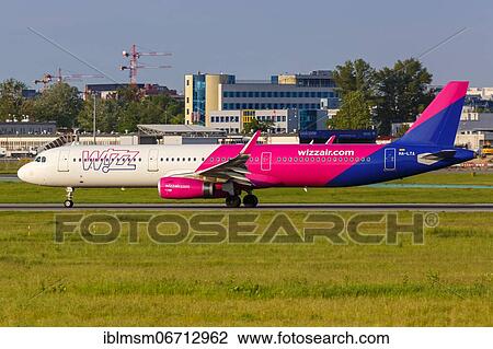An Airbus A321 aircraft of Wizzair with registration number HA-LTA at Warsaw Airport, Poland, Europe View Large Photo Image Stock Image - An Airbus A321 aircraft of Wizzair with registration number HA-LTA at Warsaw Airport, Poland, Europe. Fotosearch