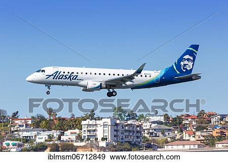 An Alaska Airlines Skywest Embraer ERJ 175 aircraft with registration N191SY lands at San Diego Airport, U. S View Large Photo Image Stock Photo - An Alaska Airlines Skywest Embraer ERJ 175 aircraft with registration N191SY lands at San Diego Airport, U. S. Fotosearch