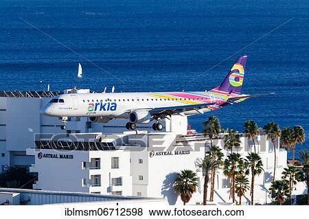 Stock Photo - An Arkia Embraer 195 with registration 4X-EMF lands at Eilat Airport, Israel, Asia. Fotosearch