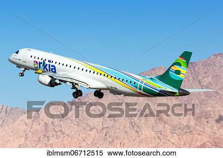 Stock Photography - An Arkia Embraer 195 with registration 4X-EMA takes off from Eilat Airport, Israel, Asia. Fotosearch