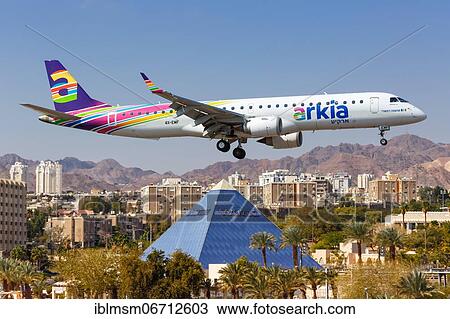 Stock Image - An Embraer 195 aircraft of Arkia with registration number 4X-EMF lands at Eilat Airport, Israel, Asia. Fotosearch