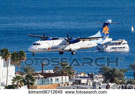 Stock Photo - An Israir ATR 72-500 aircraft with registration number 4X-ATI lands at Eilat Airport, Israel, Asia. Fotosearch