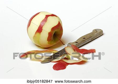 Stock Photo - Apple, apple skin, apple peel, peeled, Pink Lady variety, knife, peeling knife. Fotosearch