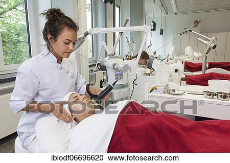 Application of the white face pack with moisture and vitamins in connection with the brush grinder for peeling the skin in practical lessons. Training as a beautician at the vocational school, Düsseldorf, North Rhine-Westphalia, Germany, Europe View Large Photo Image Stock Image - Application of the white face pack with moisture and vitamins in connection with the brush grinder for peeling the skin in practical lessons. Training as a beautician at the vocational school, Düsseldorf, North Rhine-Westphalia, Germany, Europe. Fotosearch