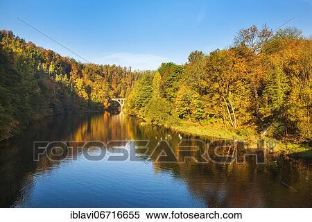 Autumn at the river Saale, colorful forest reflected, near Ziegenrück, nature park Park Thuringian Slate Mountains/Upper Saale, Thuringia, Germany, Europe View Large Photo Image Stock Photography - Autumn at the river Saale, colorful forest reflected, near Ziegenrück, nature park Park Thuringian Slate Mountains/Upper Saale, Thuringia, Germany, Europe. Fotosearch