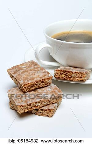 Stock Image - Basler Leckerli with cup of coffee, Lackerli, Läckerli, gingerbread. Fotosearch