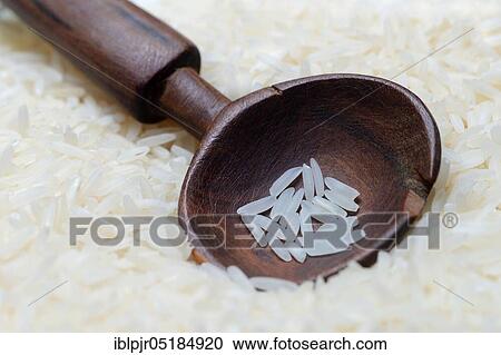 Basmati rice in wooden spoon View Large Photo Image Stock Image - Basmati rice in wooden spoon. Fotosearch