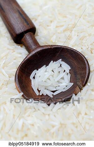 Basmati rice in wooden spoon View Large Photo Image Stock Photo - Basmati rice in wooden spoon. Fotosearch